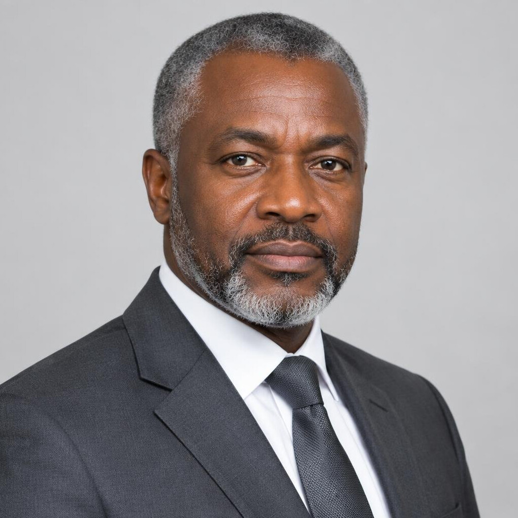 Studio portrait of a Belgian man of African descent in his fifties wearing a suit